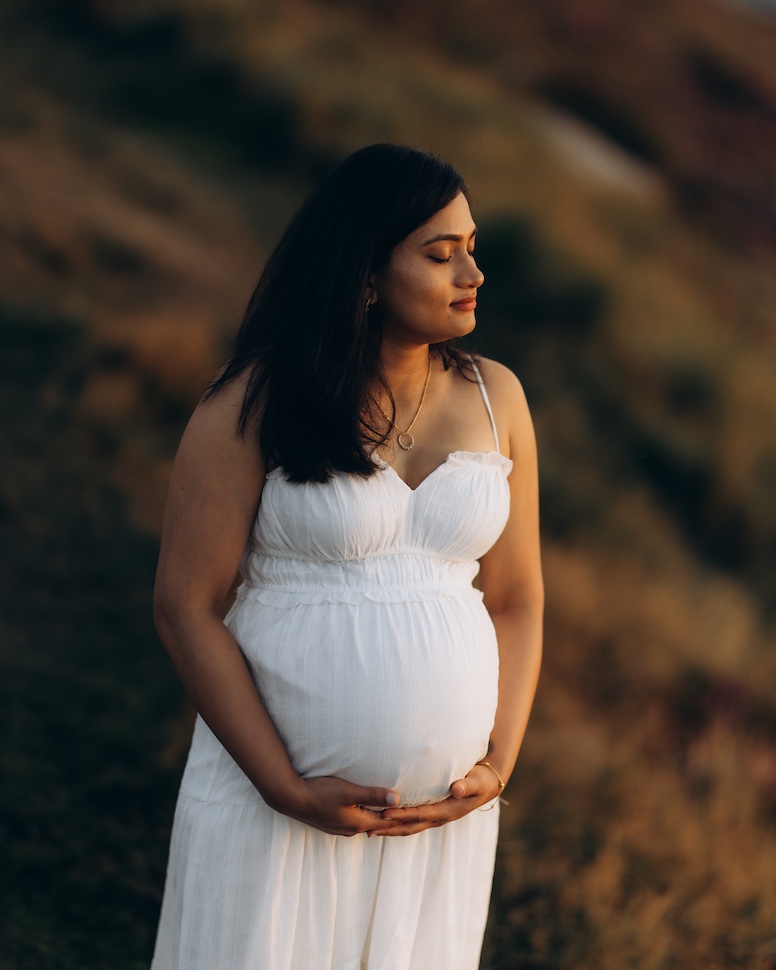 Maternity portrait at Lough Tay Wicklow — expecting couple in mountain landscape